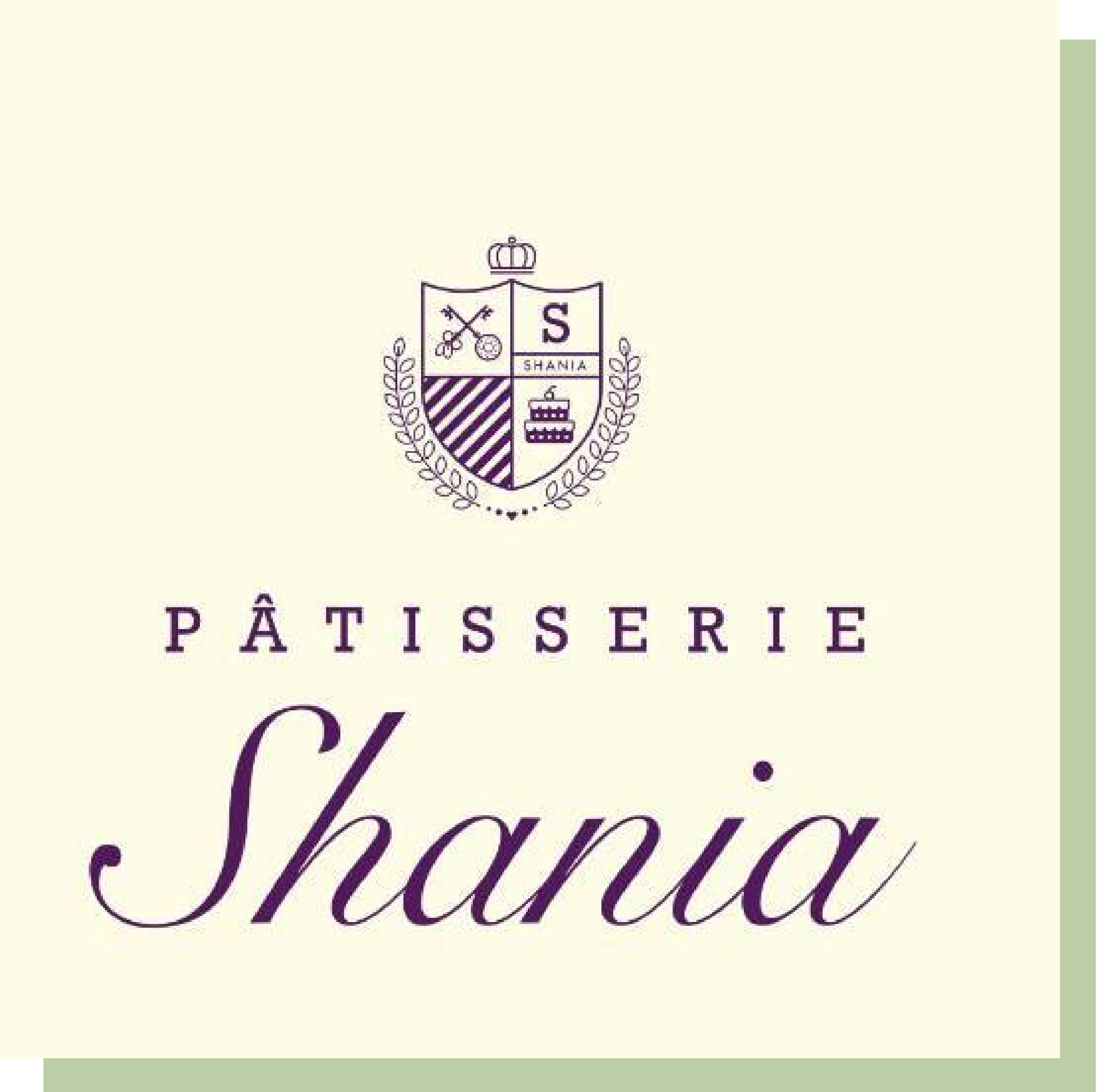 以金色裝飾邊框的甜點店Logo，盒面印有品牌標誌和“PÂTISSERIE Shania”字樣，背景為柔和的綠色調