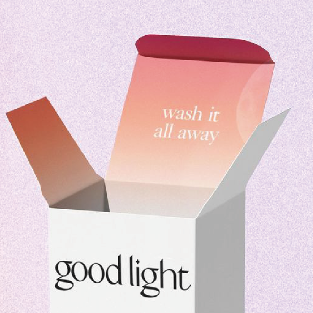 淺紫色的背景下，一個外面是白色，裡面是由白至紅漸變色的盒，內面印有"Wash it all away"，外面則印有 "good light"
