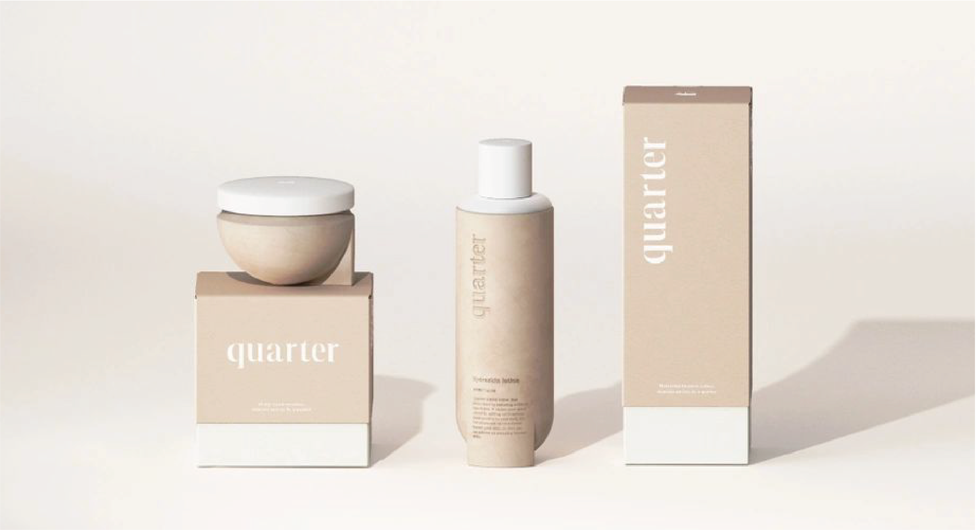 The image shows three personal care products in a minimalist design. A white circular container on the top of the lid, a bottle of body lotion, and a rectangular box, all in beige with the word "quarter" printed on it.