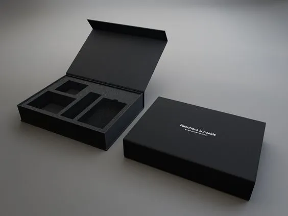 A minimalist black gift box with the words 'Handmade Soap' on the box, the lid opens to reveal the interior compartmentalised storage space, demonstrating the sophistication and practicality of the product.